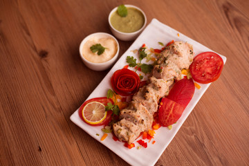 grilled beef steak with sauce and vegetables