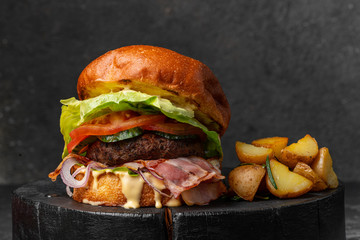 fresh tasty burger on wood table