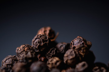 black pepper close-up on a blue background