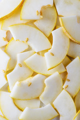 Melon slices as background. Top view, closeup.