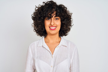 Young arab woman with curly hair wearing casual shirt over isolated white background with a happy and cool smile on face. Lucky person.