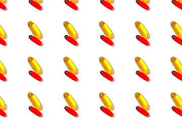 Red and yellow pills pattern isolated on white background.