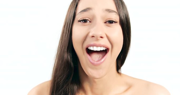 Happy attractive brunette lady smiling to camera isolated on white background, pleasant surprise