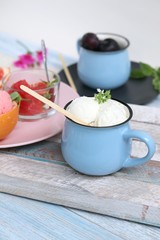 Obraz na płótnie Canvas Natural ice cream, grapefruit, basil on a wooden table, tasty and healthy dessert, seasonal food