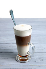 glass with coffee latte on the table