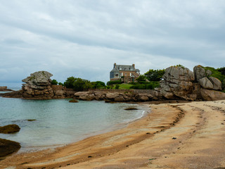 Weathered boulders near the  &Icirc;le Renote, Tr&eacute;gastel, Brittany, The rock on the left is known as the Tas de cr&ecirc;pes or pile of pancakes.