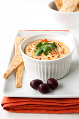 Chickpea hummus with olives and crackers