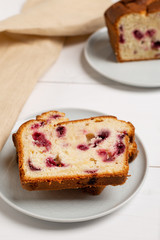Homemade berry cake on white wooden background