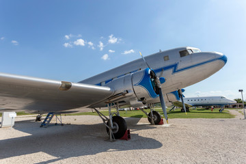 Fototapeta na wymiar Old russian propeller airplane in an old airfield