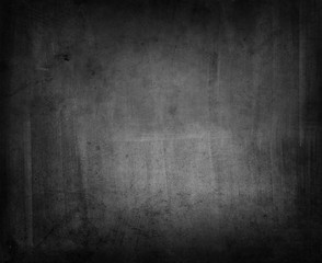Grunge black concrete textured dark wall background
