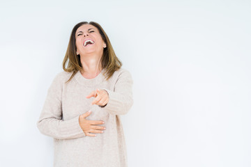 Beautiful middle age woman over isolated background Laughing of you, pointing to the camera with finger hand over chest, shame expression