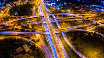 Fototapeta na wymiar Aerial view Expressway motorway highway circus intersection at Night time Top view , Road traffic in city at thailand.