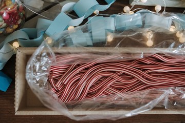 red and white polkagris sticky candies or Swedish candy canes inside of a plastic paper