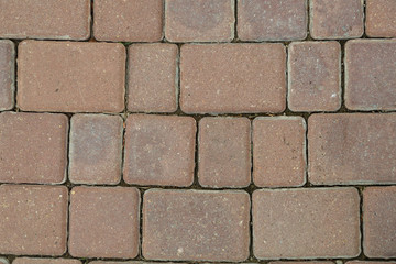Fragment of brown stone wall stonework Texture.