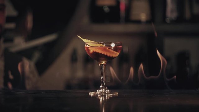 Barman make a cocktail at bar
