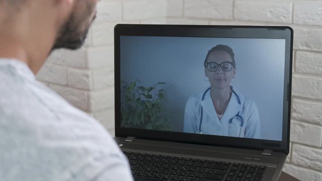 Online doctor consultation. Doctor woman at laptop screen