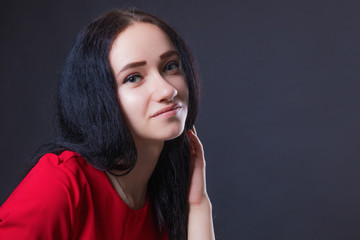 Portrait of a tender pensive girl with smiling eyes