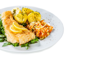 Fish dish - fried fish fillet boiled potatoes and vegetables