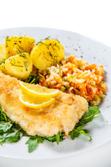 Fish dish - fried fish fillet boiled potatoes and vegetables