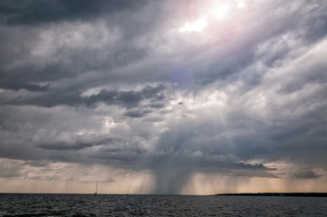 Rainy clouds over the sea