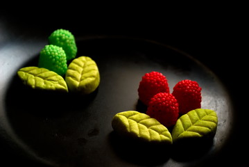 Fruit candy on black. Delicious fruit candy. Multicolored fruit candy. - 282927776