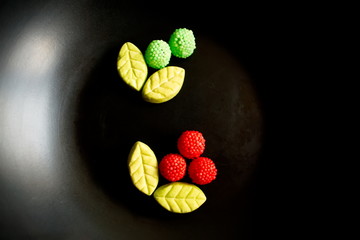 Fruit candy on black. Delicious fruit candy. Multicolored fruit candy. - 282927796