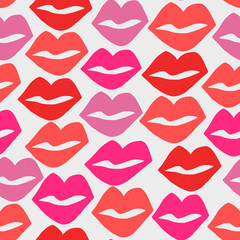 Hand painted seamless pattern with lips in red and pink on white background.