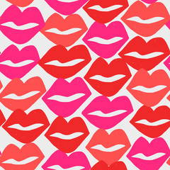 Hand painted seamless pattern with lips in red and pink on white background.