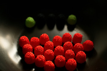 Fruit candy on black. Delicious fruit candy. Multicolored fruit candy. - 282928129