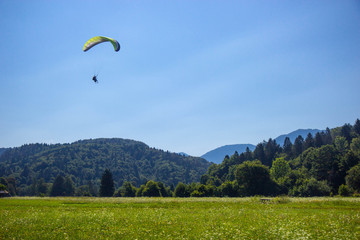 Paragliding in near lake Bohinj, Julian Alps, Slovenia