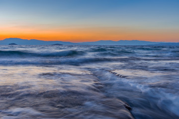 Long exposure seascape of Mediterranean Sea, at sunset.