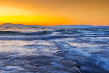 Long exposure seascape of Mediterranean Sea, at sunset.