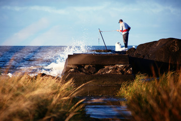 Fisherman with calderin in an old dock.