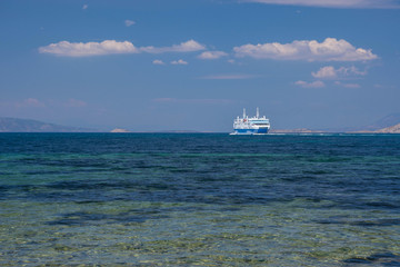 Ferry boat and the blue Mediterranean sea in the Saronic gulf, Greece.