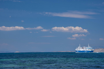 Ferry boat and the blue Mediterranean sea in the Saronic gulf, Greece.