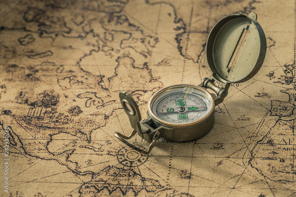 Aufkleber a compass on an old map showing the direction