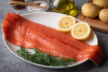 raw salmon fillet on gray background