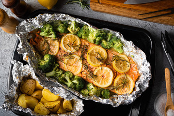 grilled whole salmon fillet with lemon and rosemarry