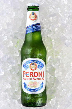 IRVINE, CA - JANUARY 11, 2015: A single bottle of Peroni Beer on a bed of ice. Founded n the town of Vigevano, Italy in 1846. The company was moved to Rome by Giovanni Peroni in 1864.