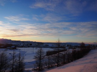 sunset in the countryside of Iceland with snow in winter