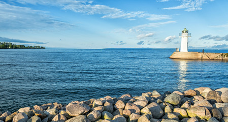 Swedish lake landscape with white lighthouse