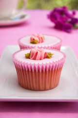 Pink flower cupcakes and a tea cup