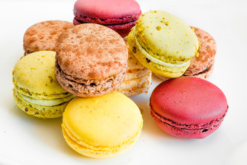 Blurred Background With Multicolored Almond Cakes. Pink and light green macaroons.