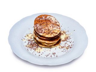 Pancakes with condensed milk sprinkled with grated chocolate