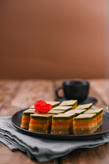 Oriental sweets with different tastes on a wooden background. Traditional dessert and coffee. Tasty national sweets. Copy space.