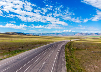 Fototapeta na wymiar Aerial view of the road leading to Dogubayazit from Igdir. Plateau around Mount Ararat, mountains and hills. Eastern Turkey on the border with Armenia and Iran