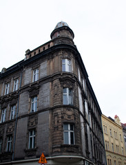 Fototapeta na wymiar Dark brown old building exterior in Krakow historic district, Poland