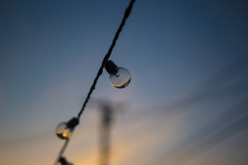 string lights on blue sky background