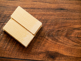 Dessert waffles on a wooden table, Close up. Copy space. Top view.