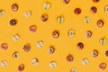 Colorful creative fruit pattern of fresh apple on yellow background. top view